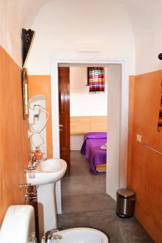 a bathroom with a sink and a toilet at Horizon Pantelleria in Pantelleria