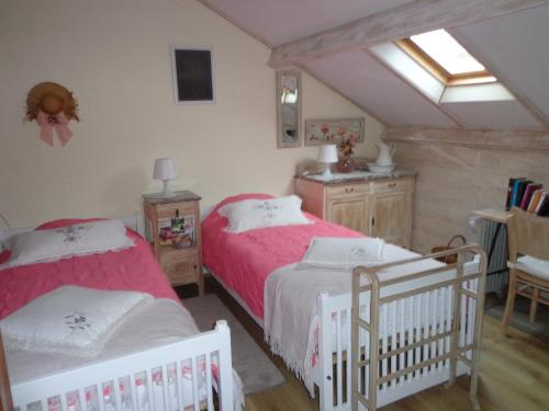 Ένα ή περισσότερα κρεβάτια σε δωμάτιο στο Le Chant du Merle