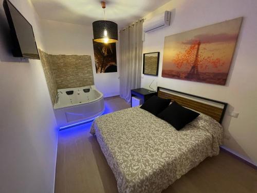 Postel nebo postele na pokoji v ubytování B&B La Perla & Suites