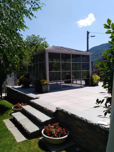 a building with some flowers in front of it at BALMA DEI CUP con SPA privata su richiesta in Pont Canavese