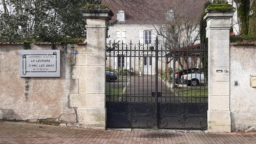 a gate to a house with a sign on it at La Levriere d'Arc les Gray Chambre D'hotes in Arc