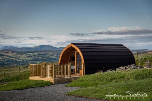 a small building on top of a hill at Lawers Luxury Glamping Pet Friendly Pod at Pitilie Pods in Aberfeldy