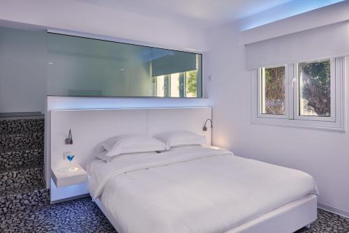 Кровать или кровати в номере So White Club Resort