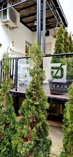 a group of trees in front of a building at Design Apartment PREMIUM SPA LUX 4 STAR "DUBAI" Completely PRIVATE Wellness & Spa FREE INCLUDED Sauna & Jacuzzi & Salt Wall & Fire place & 3D Ceilings & Business WiFi & NETFLIX & Keyless code entry & FULL SMART APP & SECURE 2 Parking place in Ćuprija