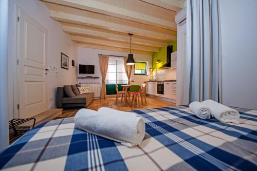 a bedroom with a blue and white bed in a room at Apartments Tizi Rovinj in Rovinj