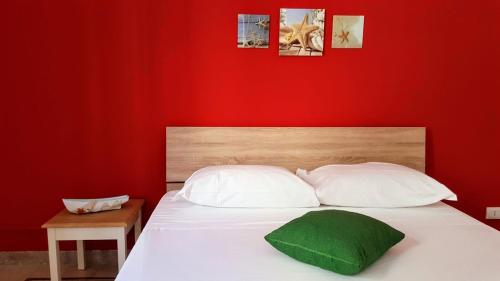 Ένα ή περισσότερα κρεβάτια σε δωμάτιο στο MAKANI APARTMENTS - San Vito Lo Capo
