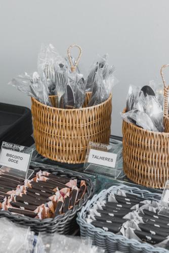 three baskets of chocolates on display on a table at Plaza Inn Trevo Sorocaba in Sorocaba