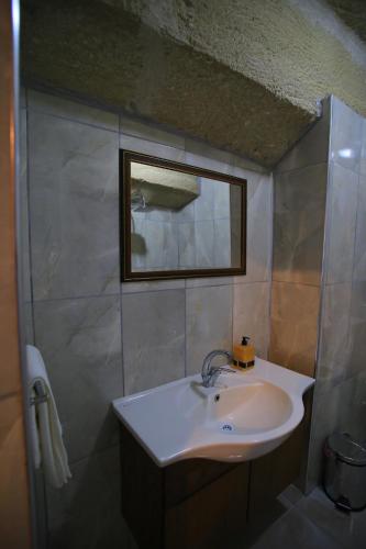 a bathroom with a sink and a mirror at DIADEM CAPPADOCIA GUEST HOUSE & HOSTEL in Goreme