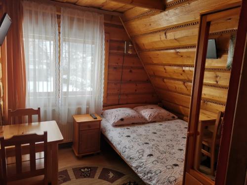 Posteľ alebo postele v izbe v ubytovaní Pod Zielonym Bykiem