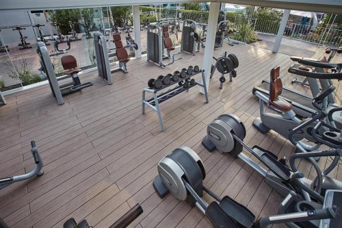 a gym with several rows of equipment on a deck at Dei Fiori Camping Village in Cavallino-Treporti