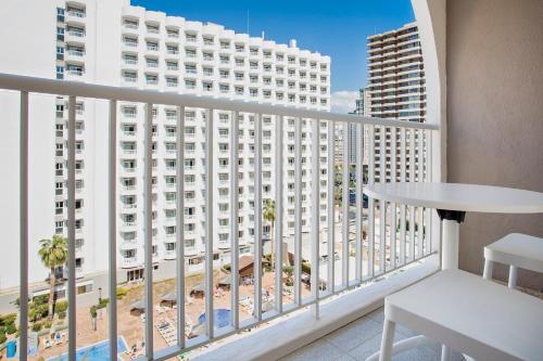 a balcony with a view of a building at Sol Pelicanos Ocas in Benidorm