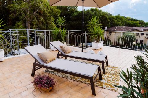 Un balcón o terraza en MARCHE FULL EXPERIENCE-Apartments
