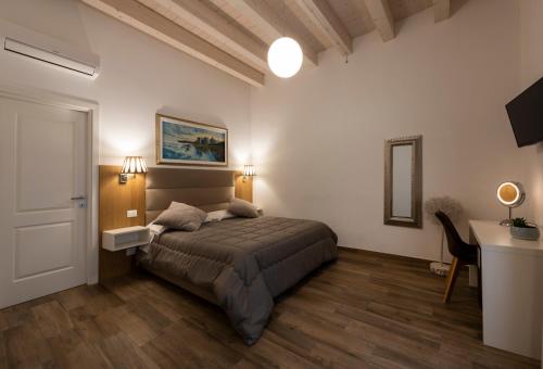 Ліжко або ліжка в номері B&B Palazzo San Michele