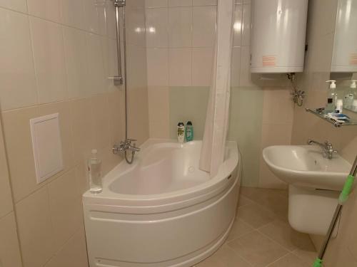 a bathroom with a shower and a toilet and a sink at Entire Private Apartment in Pirin Golf & Country Club in Bansko