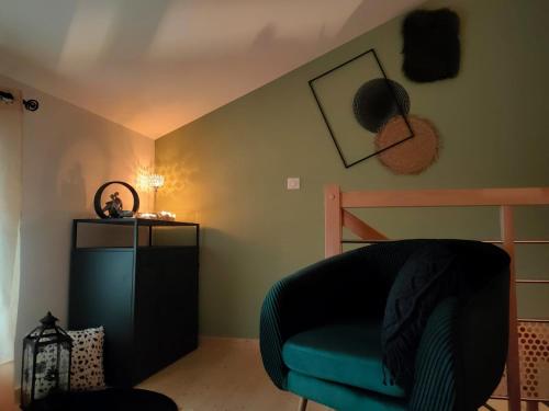 a room with a couch and a bunk bed at Echappée romantique in La Chapelle-Hermier