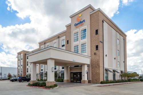 a rendering of the front of a building at Comfort Suites Near Sam Houston Race Park in Houston