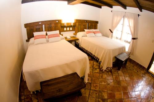 เตียงในห้องที่ Hotel Casa Selah