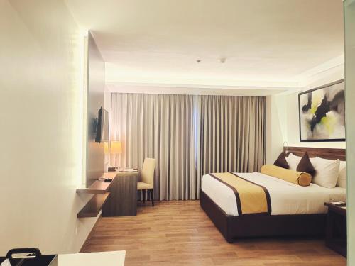Un pat sau paturi într-o cameră la Hotel Marciano
