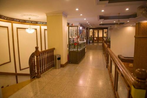 a hallway of a building with a store at Panorama Hotel in Yangon