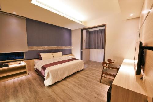 TV a/nebo společenská místnost v ubytování Yu Kun Tien Hotel