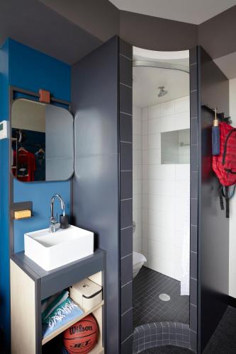 a small bathroom with a sink and a toilet at Together Co-Living Melbourne in Melbourne