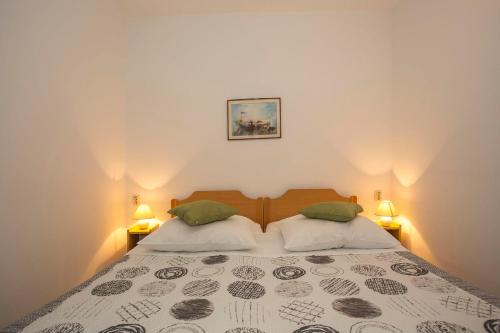 Posteľ alebo postele v izbe v ubytovaní Apartment Puh