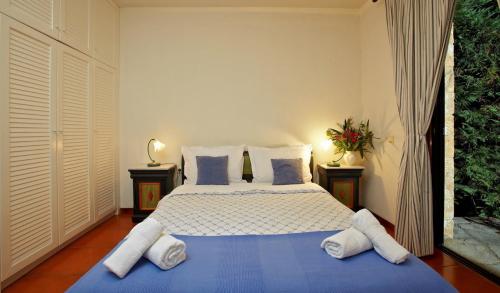 A bed or beds in a room at Villa Erato - Your Dream Getaway in Sani Seaside