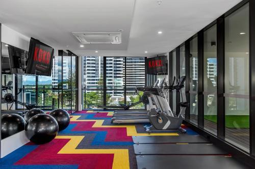 a fitness room with a gym with exercise equipment at Koko Broadbeach in Gold Coast