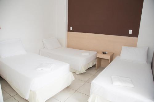 Cama ou camas em um quarto em Plaza Inn Trevo Sorocaba