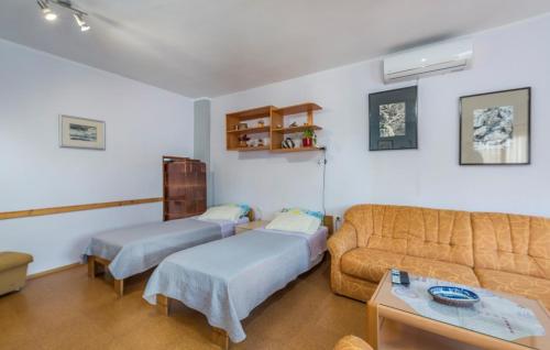 A bed or beds in a room at Apartments Stanisic