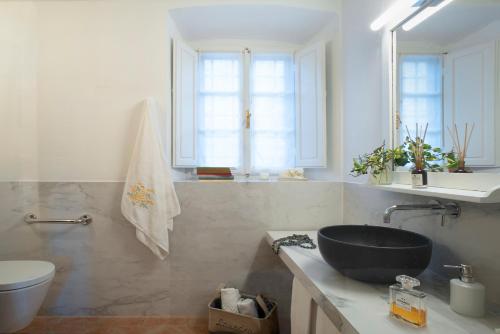 a bathroom with a sink and a toilet at Castello di Volpaia in Radda in Chianti