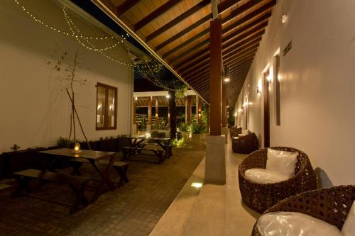 a lobby with couches and tables in a building at Swanee Grand in Negombo