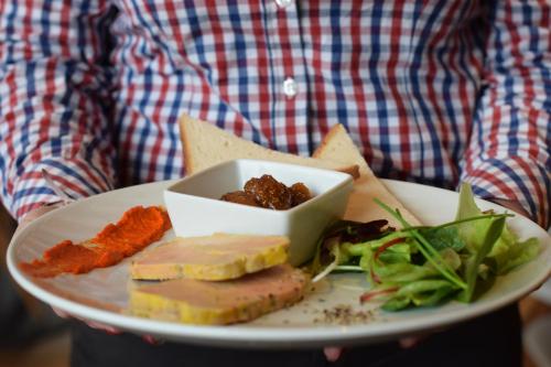 a plate of food with cheese and meat and salad at ibis Montpellier Centre Polygone in Montpellier