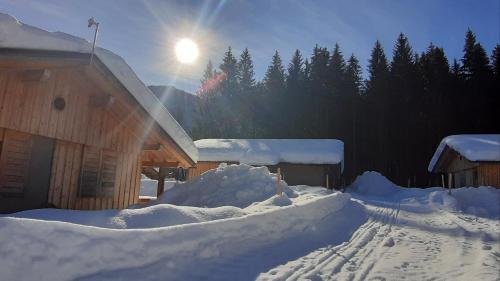 a pile of snow in front of a building at Dobringers Chalet-Dorf Warös in Hermagor