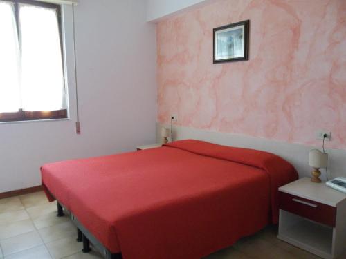 Кровать или кровати в номере Albergo Ristorante Gori