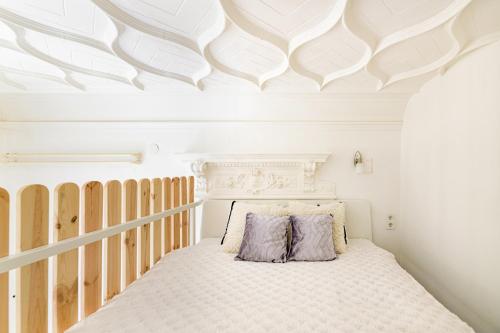 a bedroom with a bed and a white ceiling at Crystal Downtown Apartments in Budapest