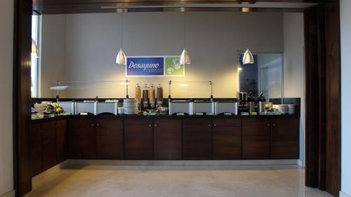 a restaurant with a counter in a room at Holiday Inn Express Puerto Vallarta by IHG in Puerto Vallarta