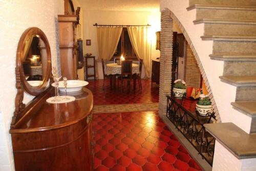 a bathroom with a sink and a mirror at Villa Mery, sui colli della riviera di Rimini in Mondaino