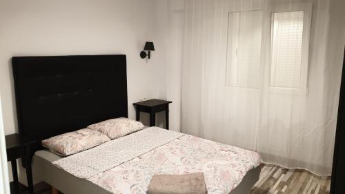 Postel nebo postele na pokoji v ubytování Apartamento Plaza Manila