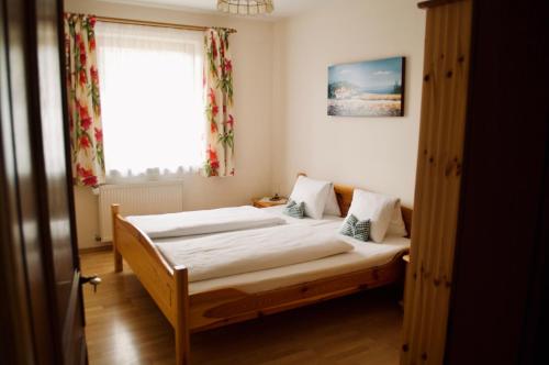 Postel nebo postele na pokoji v ubytování Haus Dorfer