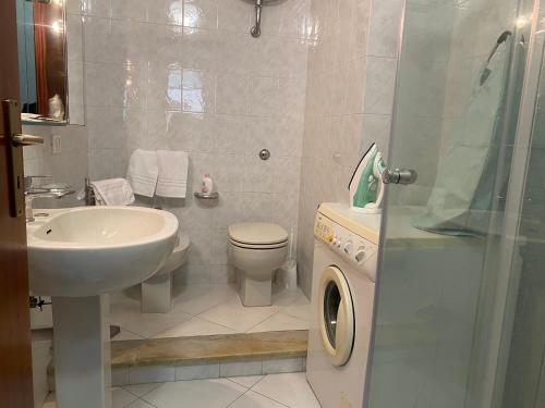 a bathroom with a sink and a toilet and a shower at Residenza al mare a Calalunga di Montauro in Montauro