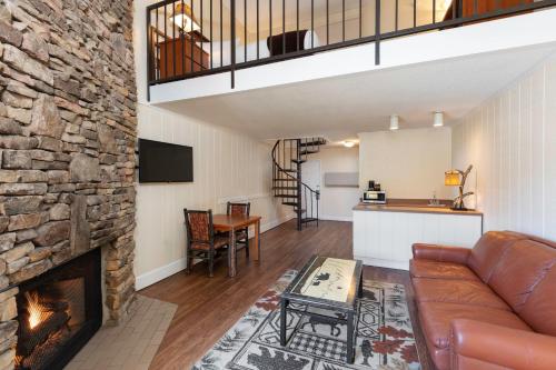 a living room with a couch and a fireplace at River Terrace Resort & Convention Center in Gatlinburg