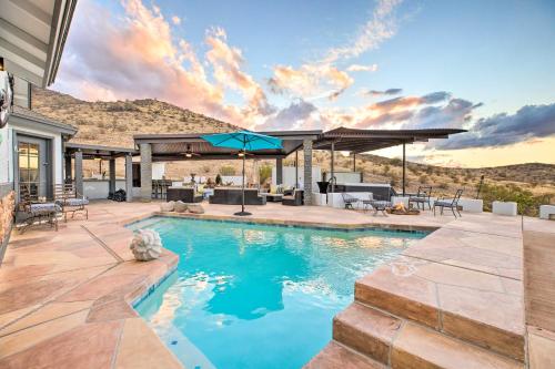 a swimming pool with a patio and a house at 11 Mi to Dtwn Phoenix! Mtn-View Retreat with Hot Tub in Phoenix