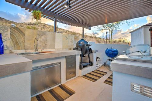 a kitchen with a sink and a counter top at 11 Mi to Dtwn Phoenix! Mtn-View Retreat with Hot Tub in Phoenix