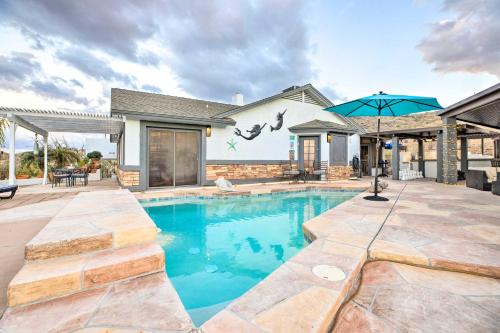a swimming pool in front of a house at 11 Mi to Dtwn Phoenix! Mtn-View Retreat with Hot Tub in Phoenix