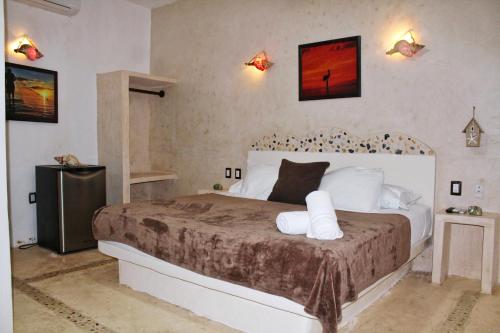 מיטה או מיטות בחדר ב-Casa Ohana-Disfruta del paraiso