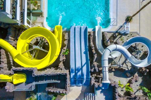 a water park with a pool and a water slide at Spring Hotel Bitácora in Playa de las Americas