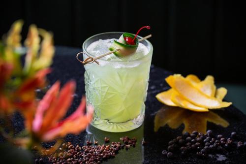 a drink with a cherry on top of a table at Sofitel Wellington in Wellington