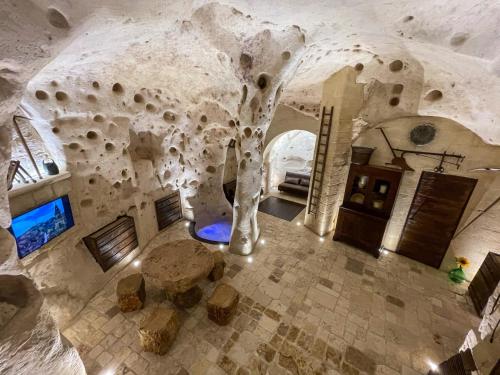 an overhead view of a room with a stone wall at La Suite Nella Roccia in Matera