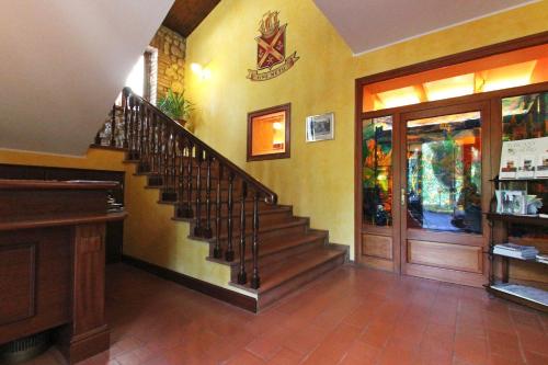 a lobby with a staircase in a building at La Torre Ai Mari in Sarteano